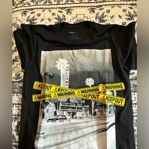 Black Graphic Tee with Yellow Warning Tape Design